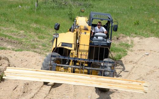 Matt carrying supplies with telehandler