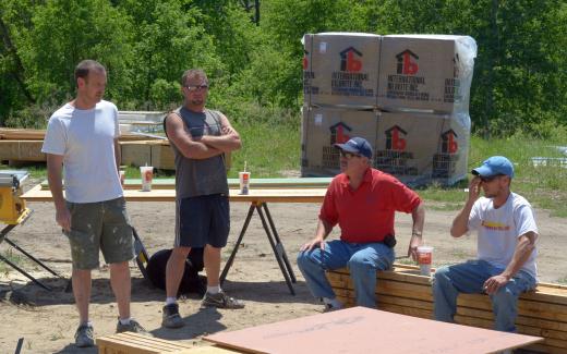 Andy, Bill, Fred, Matt in front of materials