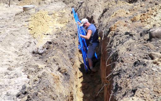 Randy LaLone placing water line