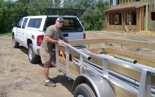 Bryan Bach preparing conduit for electrical service