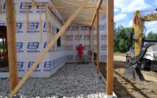 Gravel beneath porch