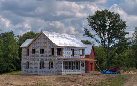 First floor windows in; detached garage in background