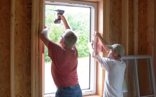 Michael and Matt installing window frame