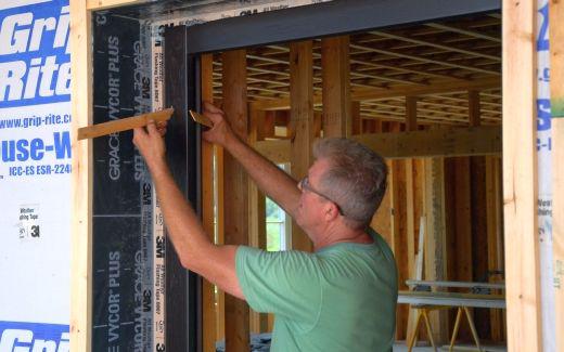 Michael installing front door