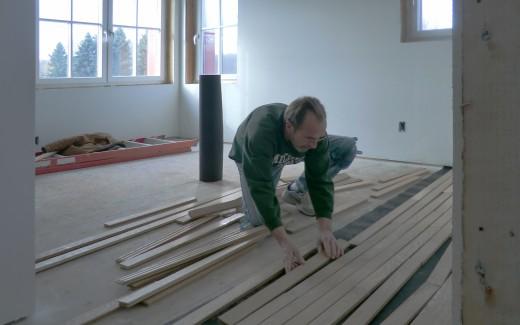 Lee installing floor in guest bedroom