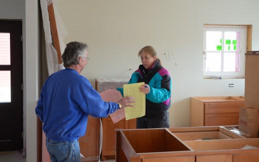 Bob Hewson and Maura discussing tiles