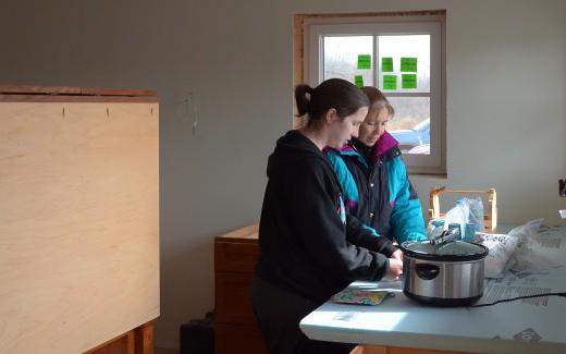 Laura and Maura preparing a lunch for the work crew