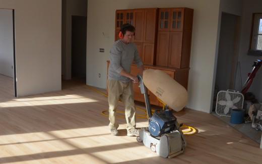 Larry Zalesny sanding kitchen floor