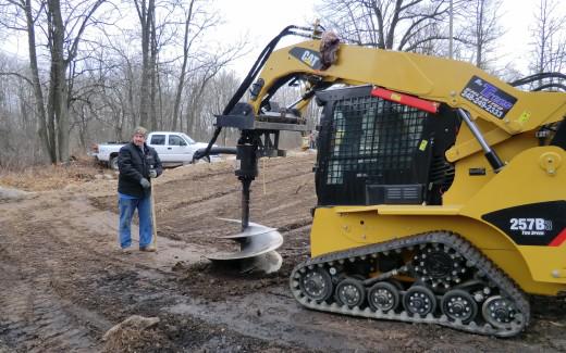 Brad and Bryan digging hole with auger