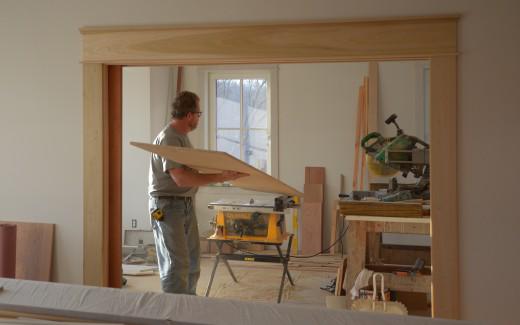 Michael working on library bookshelves