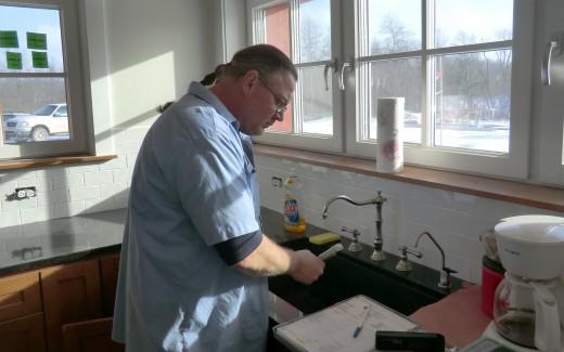 Kerry installing faucet